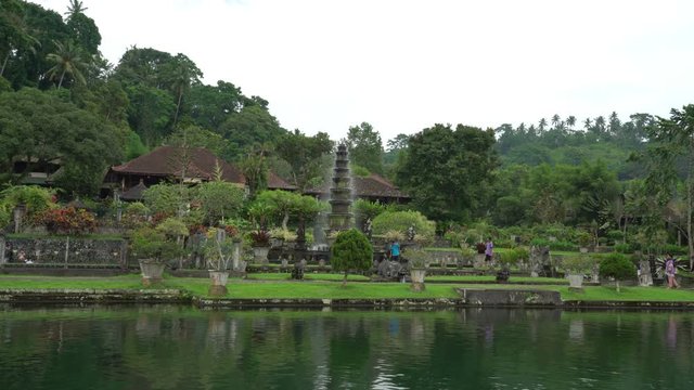 tirta ganga beautiful water palace green park in bali indonesia, fountain stream, wonderful nature landscape, place for meditation and relaxation