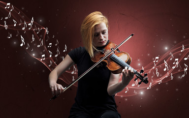 Fototapeta premium Lonely musical composer with violin and sparkling musical notes around
