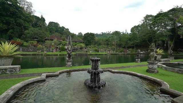tirta ganga beautiful water palace green park in bali indonesia, fountain stream, wonderful nature landscape, place for meditation and relaxation