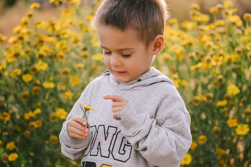 baby boy with yellow flowers