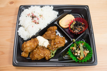 Japanese obento (rice plate) with sweet and sour chicken with mayonaise