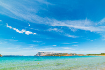 Blue sky over Capo Coda Cavallo coastline