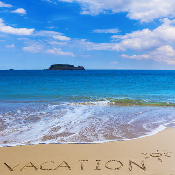VACATION insctiption under the sun drawing on wet beach sand with the turquoisesea and the island on background