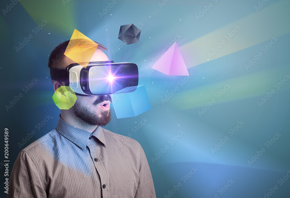 Poster amazed businessman with virtual reality colorful geometric shapes in front of him