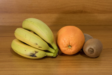 Fruits composition with bananas oranges and kiwi