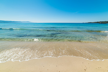 Clear water and white sand in Le Bombarde beach