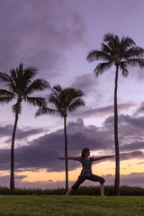Woman Practicing Yoga on the Maui Coast at Sunset