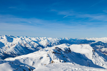 Fototapeta na wymiar Amazing view to Alps from the mountain top at the french ski resort Three Valleys, Meribel, Courchevel, France.
