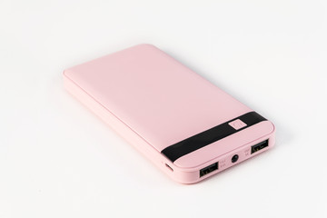 Cute power bank isolated on a white background..Pink power bank. Pink charger.