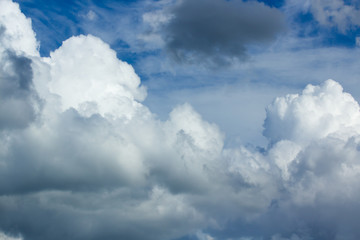 Obraz premium White fluffy clouds in the blue sky