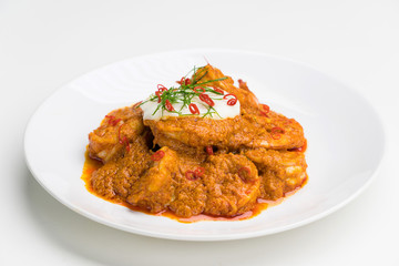 Curry-fried shrimps isolated on a white background. Thai food. Copy space. For design. Thai food concept.