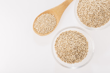 Quinoa grains in bowl isolated on white background, Chenopodium quinoa