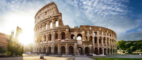 Colosseum in Rome and morning sun, Italy