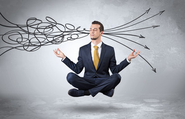 Businessman levitates in yoga position and systematize with thinking concept
