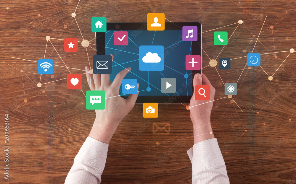 Poster Hand touching multitask tablet with cloud wifi message social media call icons and symbols concept
