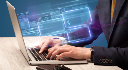 Hand typing on laptop with online accounting system concept
