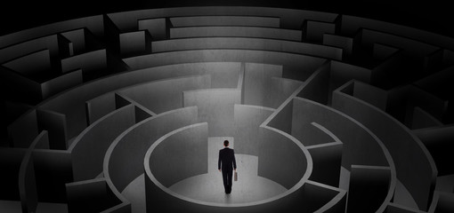 Businessman can not decide which entrance to chose in a middle of a dark maze
