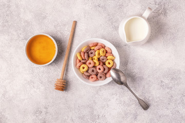Colorful cereal rings in bowl.