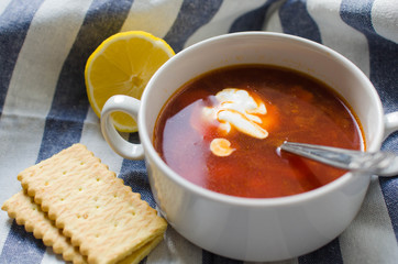Red-beet soup with lime and crisp bread and sour cream