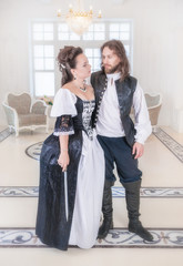 Beautiful couple woman and man in medieval clothes