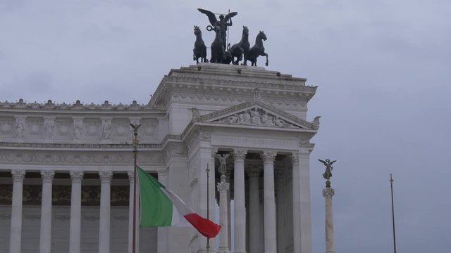 Goddess Victoria statue and a flag in Rome