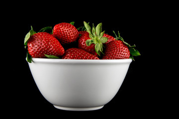 Ceramic Bowl of Strawberries on a Black Background