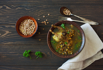 Lentlis and mushrooms soup with quail