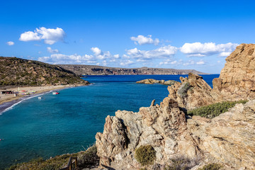 sunny summer day, views of the hill to the Mediterranean Sea, the beach and the coastline. Wonderful blue-green sea water, blue sky with white clouds.