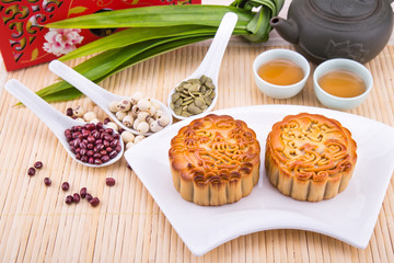 Mooncake for Chinese mid-autumn festival celebration, wih ingredients and tea.