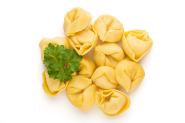 Raw homemade pasta,tortellini with herbs.