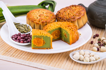 Mooncake for Chinese mid-autumn festival celebration, wih ingredients and tea.