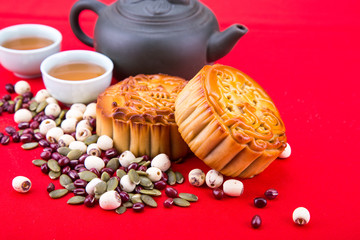 Fototapeta na wymiar Mid-Autumn festival Chinese mooncake with ingredients and tea
