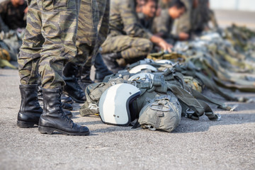 row of paratrooper in camouflage uniform standby with t-10 parachute helmet and equipment with copy...