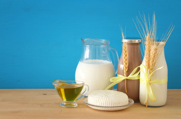 image of dairy products over wooden background. Symbols of jewish holiday - Shavuot.