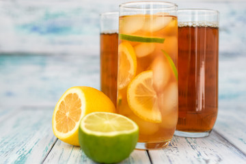tea with ice slices, slices of lemon and lime