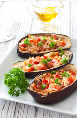 Eggplants stuffed with tomatoes , sweet peppers and ricotta