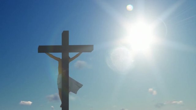 Jesus cross against blue sky
