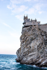 The south coast of Crimea. The castle-palace "Lastochkino Gnezdo" on the Aurorino cliff of Cape Ai-Todor in the Gaspra, evening