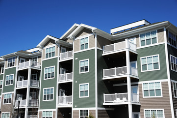 Close up on modern apartment building with blue sky