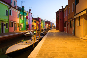 Fototapeta na wymiar Evening twilight on the urban canal of the Burano island. Venice, Italy