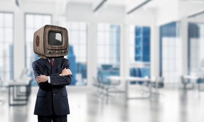 Businessman with old TV instead of head.