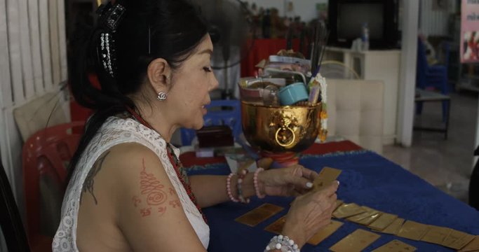 Palm reader reading cards in Thailand