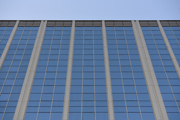 Fototapeta premium The glass surface of the building. Perspective. Building with glass surface and reflection