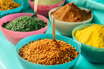 aromatic spices on plates in the market of india