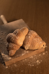 Homemade croissants on wooden table
