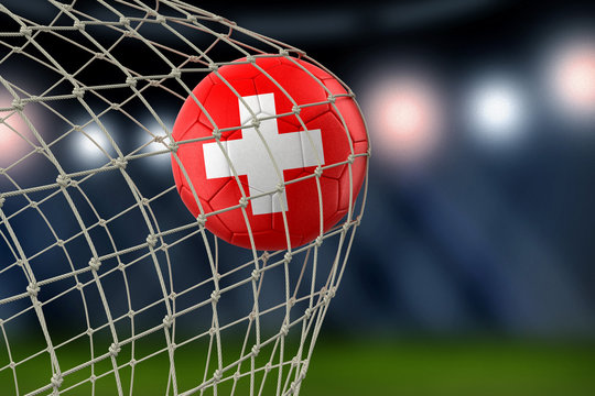 Swiss soccerball in net