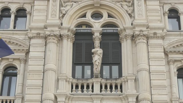 Marble statue pillar on a facade