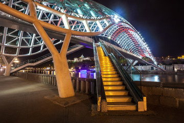 Pedestrian bridge of peace over the Mtkvari (Kura) River in Tbilisi at night