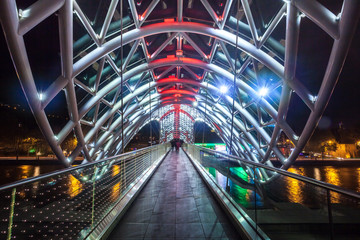 Pedestrian bridge of peace over the Mtkvari (Kura) River in Tbilisi at night © k_samurkas
