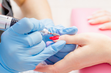 Manicure process, cleaning of nails by a milling cutter © andrei310
